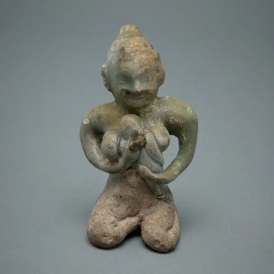 A Sawankhalok stoneware figure (tukatha),